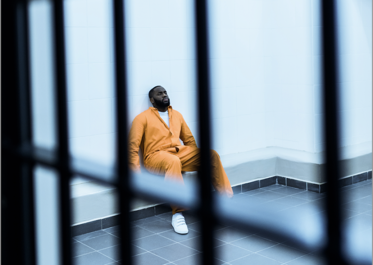 Man sitting outside a courthouse looking stressed after a DUI arrest in Greenville SC
