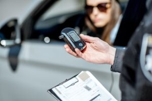 Greenville DUI defense lawyer reviewing pre-trial evidence and breathalyzer records for client