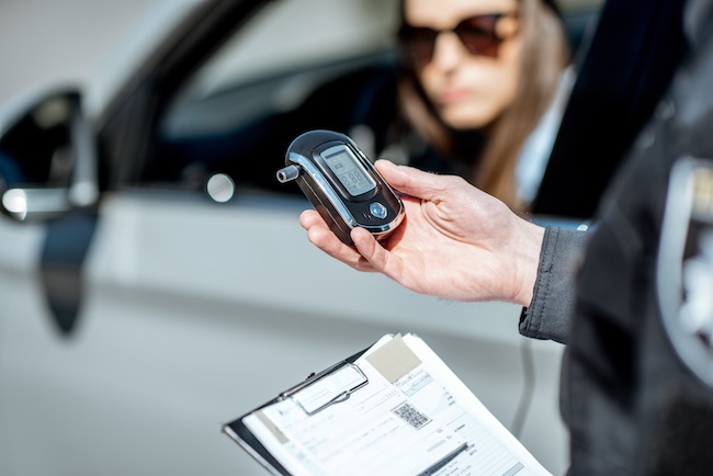 Greenville DUI defense lawyer reviewing pre-trial evidence and breathalyzer records for client